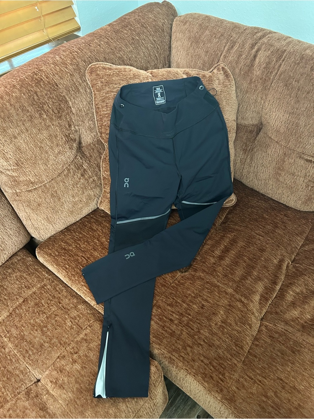 On Running woman’s Black Jogger Pants with Reflective Accents